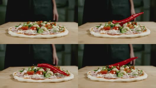 SLO MO:在披萨上加辣椒高清在线视频素材下载