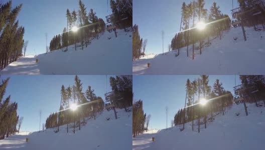 滑雪缆车把人们抬上山。滑雪者从多雪的山上下来。人们在滑雪，高山上的云杉，阳光灿烂的日子高清在线视频素材下载