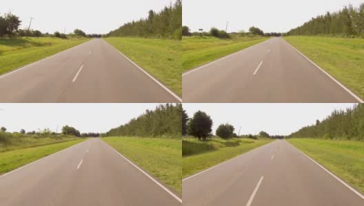 驾驶骑一辆汽车在一个乡村边的道路，山谷- POV板-观点前面高清在线视频素材下载