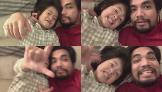 亚洲家庭与快乐的儿子在床上玩高清在线视频素材下载