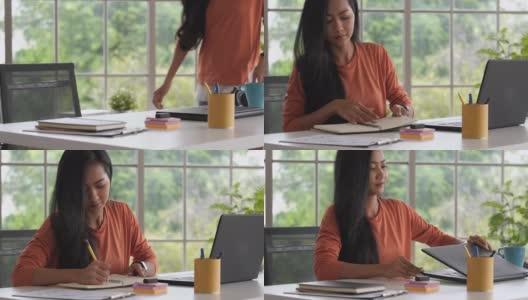 亚洲女性打开笔记本电脑开始在家工作。新常态的办公室生活方式高清在线视频素材下载