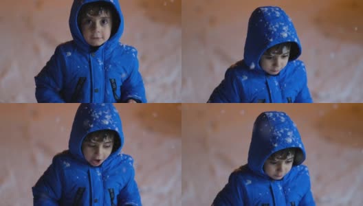 学前班的男孩晚上在雪地里玩。高清在线视频素材下载