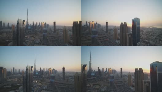 日落时分，迪拜市中心的全景，哈利法塔和繁忙的高速公路交通高清在线视频素材下载