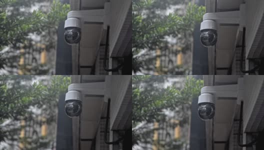 中国香港- 2019年8月:新的安全轴摄像头扫描街道。用4K摄像头录制视频。大楼的监控录像高清在线视频素材下载