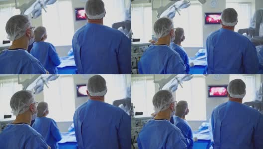 手术室有机器人机器。手术室的自动化机械手和未来医院的外科医生高清在线视频素材下载