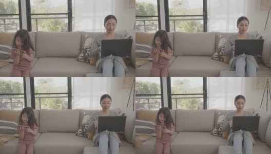 亚洲妇女在家工作带孩子，电子学习，成人学生班，在家上学，自由职业，新常态概念高清在线视频素材下载