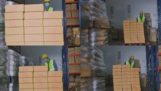 仓库工人在仓库物流中搬运货物。高清在线视频素材下载