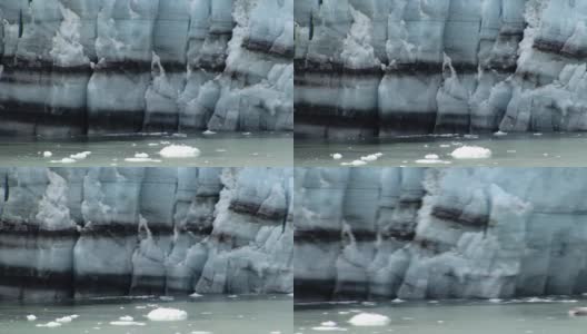 玛格丽冰川巨大冰墙的细节。海湾里的冰正在崩解。高清在线视频素材下载