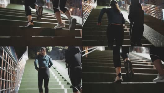 两个运动女人在晚上跑上楼梯高清在线视频素材下载