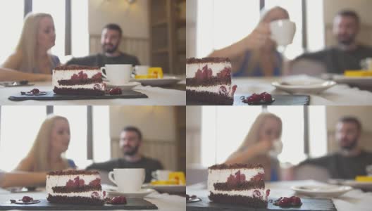 甜蜜的蛋糕面前的情侣坐在咖啡馆享受谈话高清在线视频素材下载