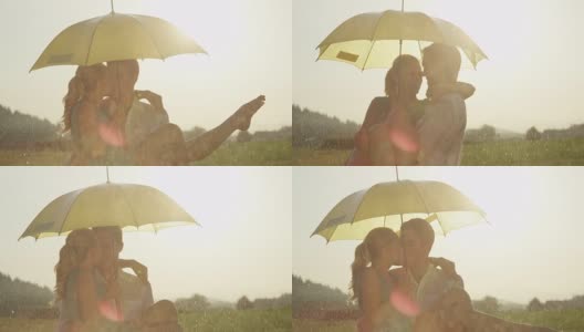 近距离特写:湿透的男人抱着他的女朋友，在雨中亲吻她。高清在线视频素材下载
