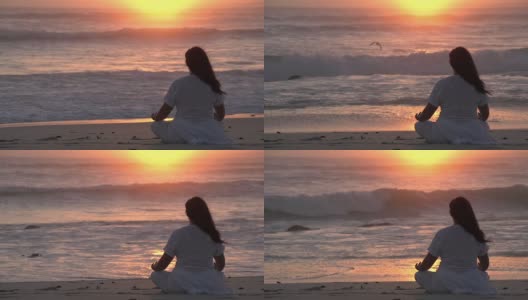 南非，日落时分，一名女子在海滩上沉思高清在线视频素材下载