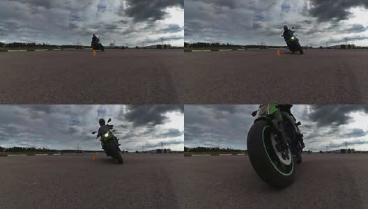 骑摩托车的人慢慢地骑在相机上高清在线视频素材下载