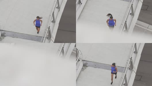 从市中心的桥上跑过的女人高清在线视频素材下载