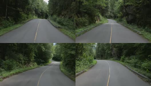 4K视频的汽车驾驶在山区森林道路，魁北克，加拿大高清在线视频素材下载