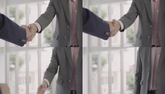 慢动作——在招聘会议后握手以达成协议。两个自信的亚洲商人在办公室开会时握手，成功，交易，问候和合作伙伴的概念。高清在线视频素材下载