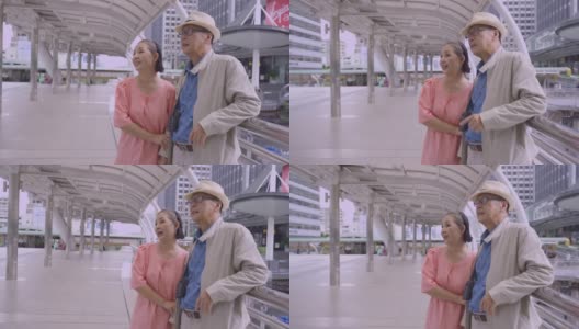 亚洲老年夫妇拿着地图搜索泰国的目的地街道，幸福意味着一切作为灵感的概念，退休年龄老年人用自己的储蓄旅行，旅行者和生活方式的老，幸福意味着一切高清在线视频素材下载