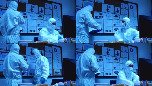 穿着防护服在实验室工作的科学家高清在线视频素材下载