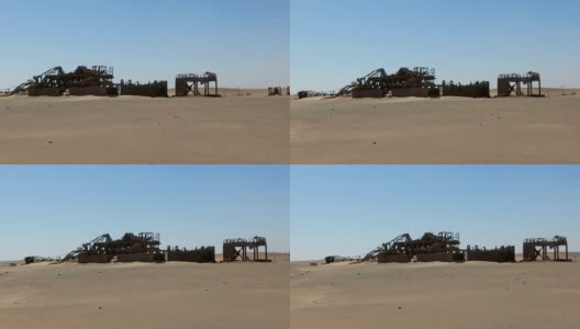 锈迹斑斑的大型石油钻井平台躺在沙漠里高清在线视频素材下载