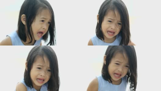 在房子里哭泣的亚洲小女孩的肖像高清在线视频素材下载