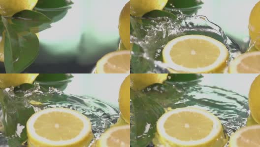 柠檬圈切片打在淡水表面。慢动作镜头高清在线视频素材下载