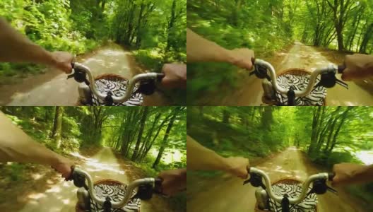 阳光森林里骑折叠自行车的男人高清在线视频素材下载