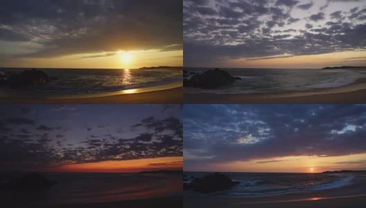 海滩上的日落随着流云越过地平线直到黄昏。高清在线视频素材下载