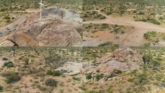 从空中俯瞰沙漠中央一座山的白色十字架高清在线视频素材下载