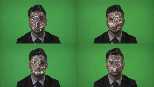 年轻的男大学生使用增强现实有化学全息公式投影在他的脸在绿色屏幕背景高清在线视频素材下载