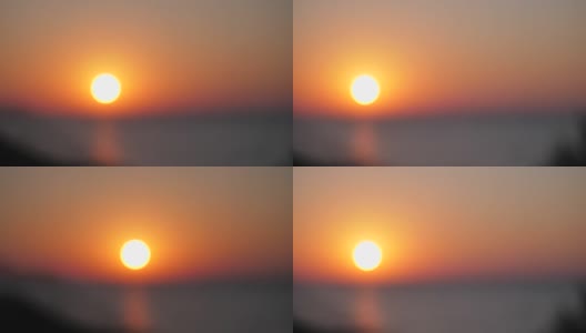 美丽的日落在海上。模糊高清镜头视频运动高清在线视频素材下载