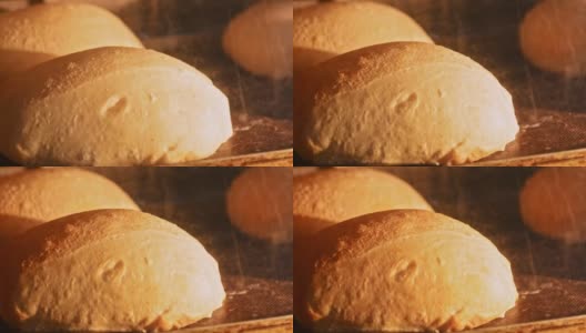 烤箱里的面包。烘焙食品和生长烤箱。美味的自制面包烘烤时间。烘焙概念高清在线视频素材下载