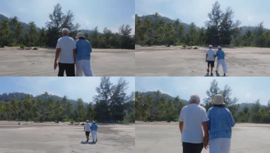 亚洲老年夫妇一起散步在海边的背景周末假期。老年人快乐生活的概念。高清在线视频素材下载