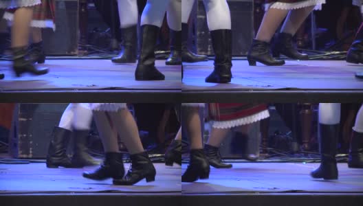 在这一场景中，男孩和女孩穿着民族服装跳舞，脚穿靴子，靴子随着音乐的节奏移动高清在线视频素材下载