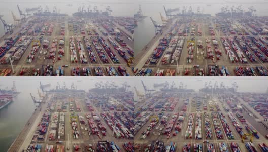 雅加达,印度尼西亚。2017年7月10日:航拍工业港口集装箱码头的吊车、卡车和货船。拍摄分辨率为4k高清在线视频素材下载