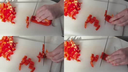 一个年轻女人切红辣椒的手。做饭准备家常饭菜的过程在家做饭的概念。呆在家里。高清在线视频素材下载