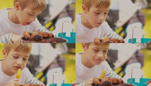 男孩吃蔬菜串高清在线视频素材下载