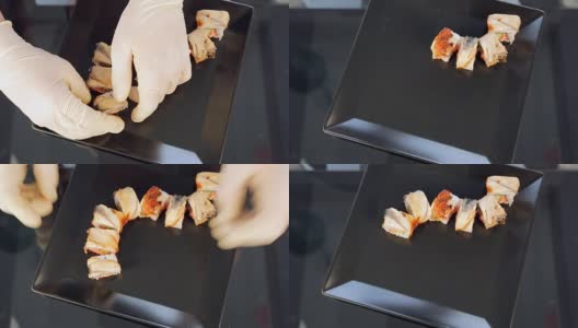 寿司卷把寿司放在一个黑色的盘子里高清在线视频素材下载