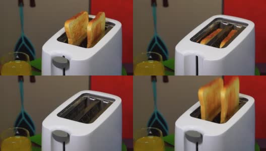 鲜红的吐司从烤面包机里蹦出来吃早餐高清在线视频素材下载