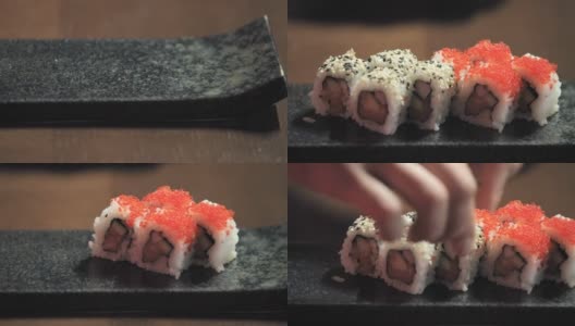 厨师的手把加利福尼亚卷放在寿司盘上高清在线视频素材下载