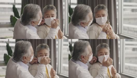 两对戴着口罩的亚洲老人互相拥抱，互相鼓励。高清在线视频素材下载