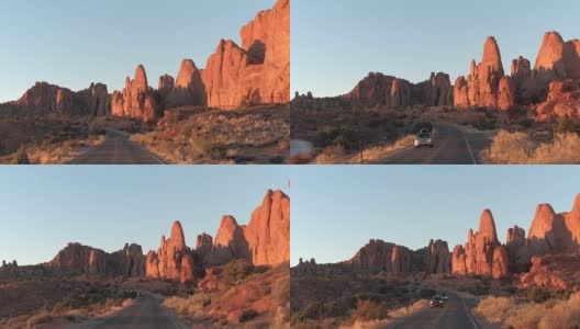 日落时分，驾车穿过风景如画的红石拱门国家公园高清在线视频素材下载