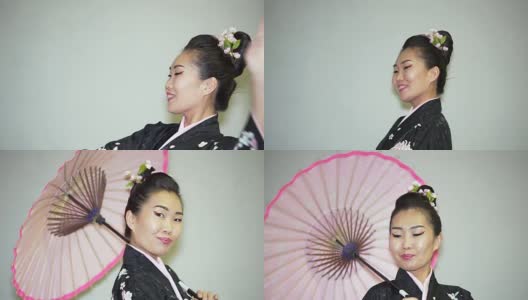 美丽的艺妓穿着传统的日本和服和阳伞高清在线视频素材下载