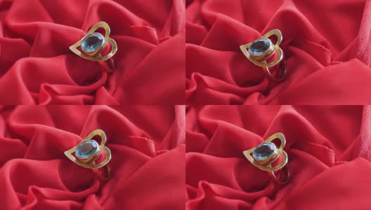 红色缎子上的钻石戒指高清在线视频素材下载