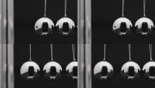 牛顿球与摆动金属球的慢动作高清在线视频素材下载
