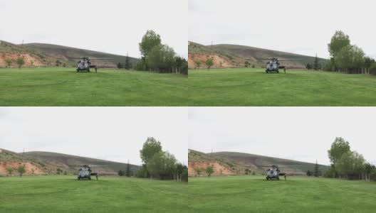 军用救援直升机(西科斯基)在乡间准备起飞高清在线视频素材下载