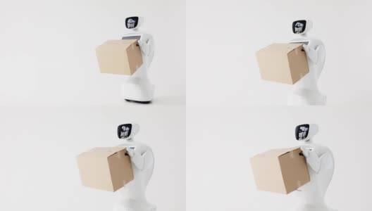 手持纸箱的人形自主机器人。今天控制论系统。现代机器人技术。白色背景高清在线视频素材下载