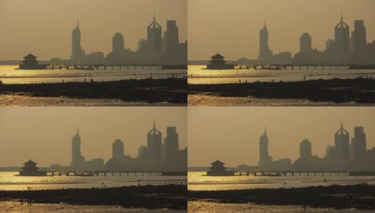 日落时间青岛城市景观著名的海滩地段潮汐码头时间流逝全景4k中国高清在线视频素材下载