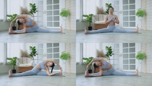 瑜伽亚洲妇女练习瑜伽姿势在她的静修或健身房，保健概念，锻炼高清在线视频素材下载