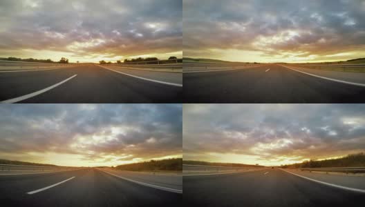 低角度的高速公路行车向日落，日出高清在线视频素材下载