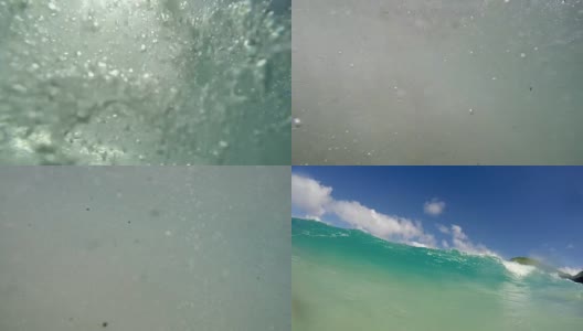 在夏威夷的海浪下游泳的第一人高清在线视频素材下载